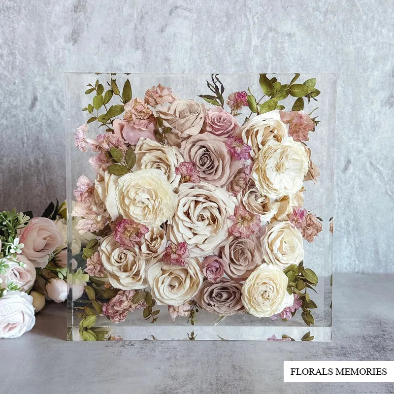 Wedding bouquet roses preserved in a clear square resin block keepsake